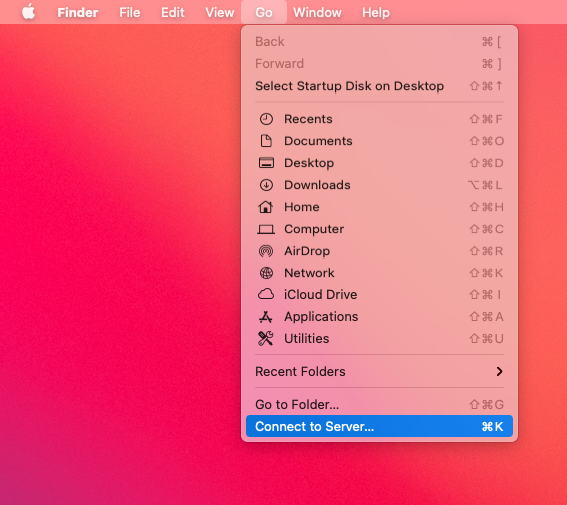 MacOS desktop with the Go menu selected showing the Connect to Server menu item at the bottom