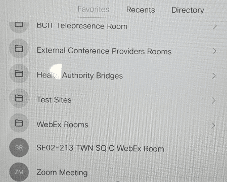 Photo of touch pad showing list of options with Zoom meeting (abbreviated as ZM) at the bottom of those visible